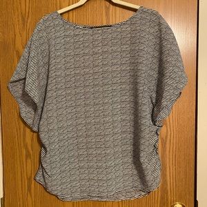 Black and white light weight breezy blouse. Side synching.